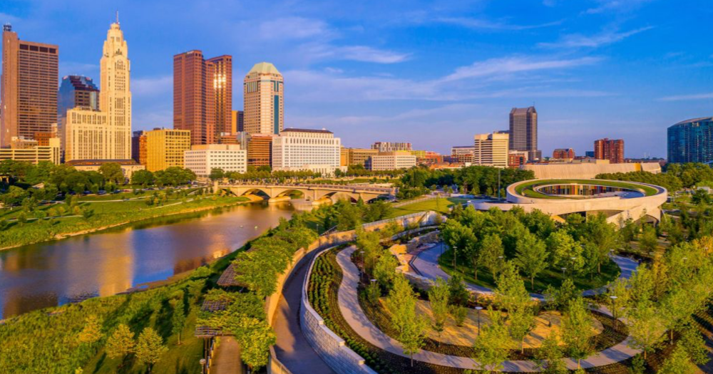 View of the City of Columbus Ohio Skyline during high noon overlooking the water with clear sky on a sunny day