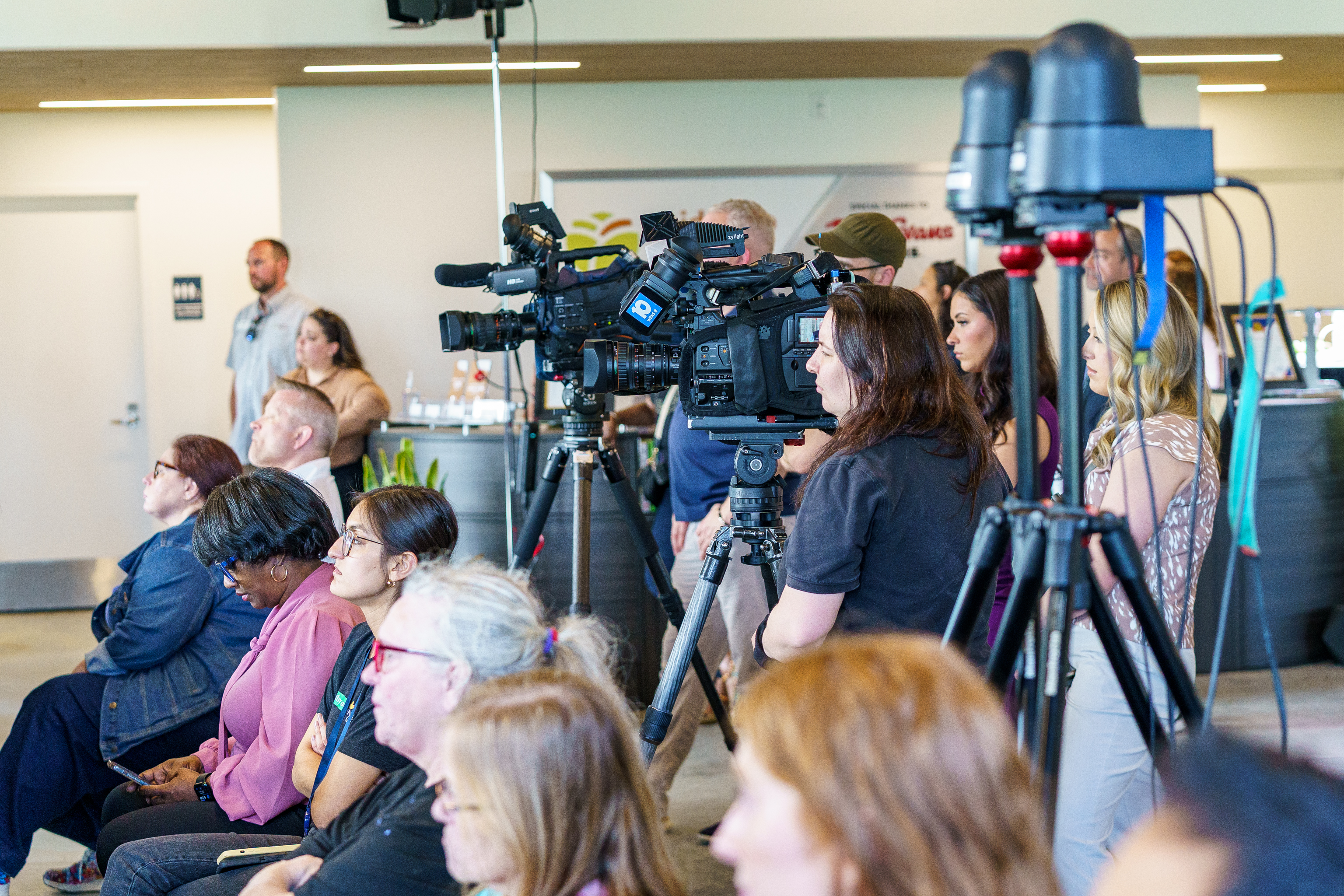  Candid shot of the press at an envision hilltop community development meeting